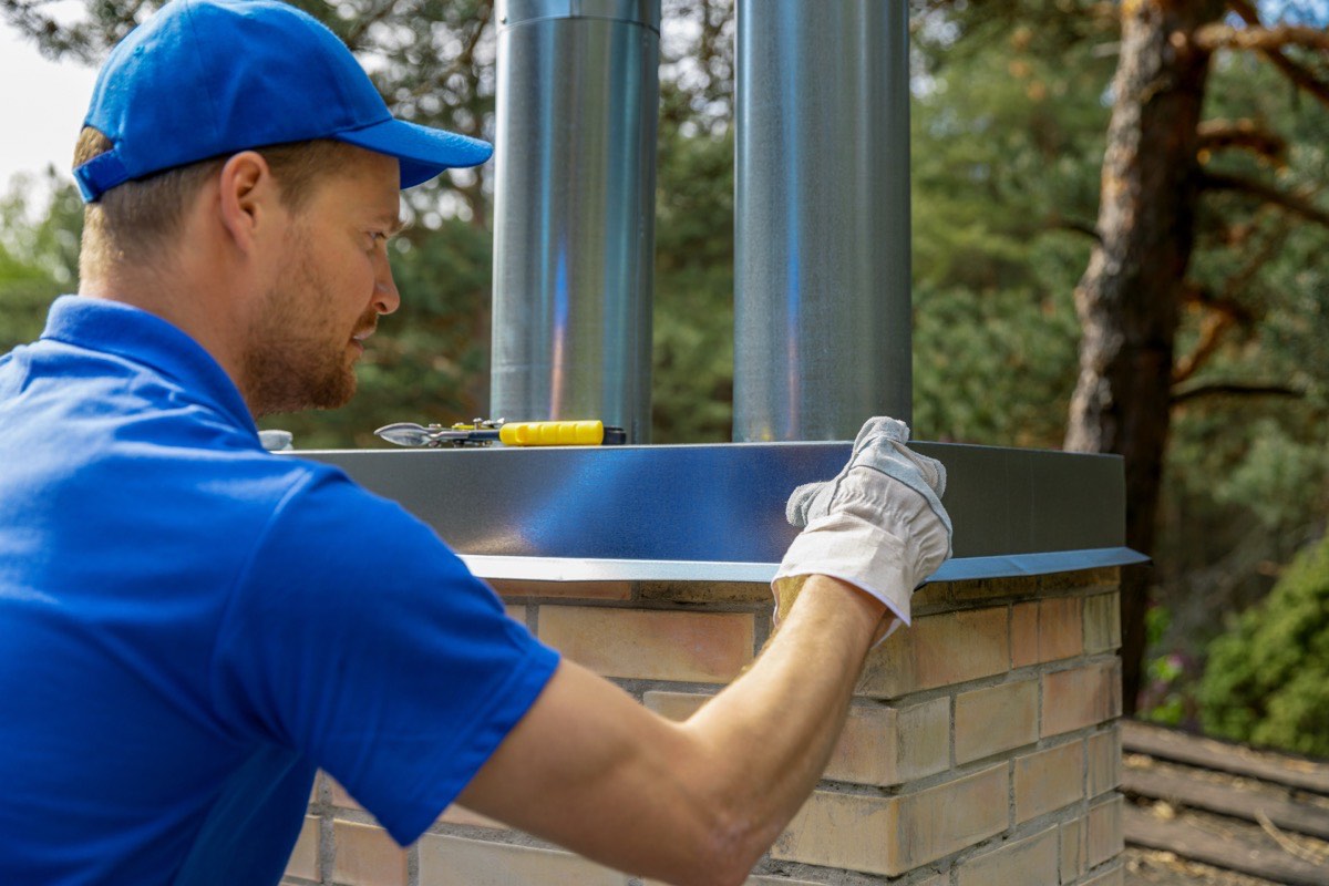 Charm City Masonry crew repairing a framed chimney chase in Owings Mills, MD