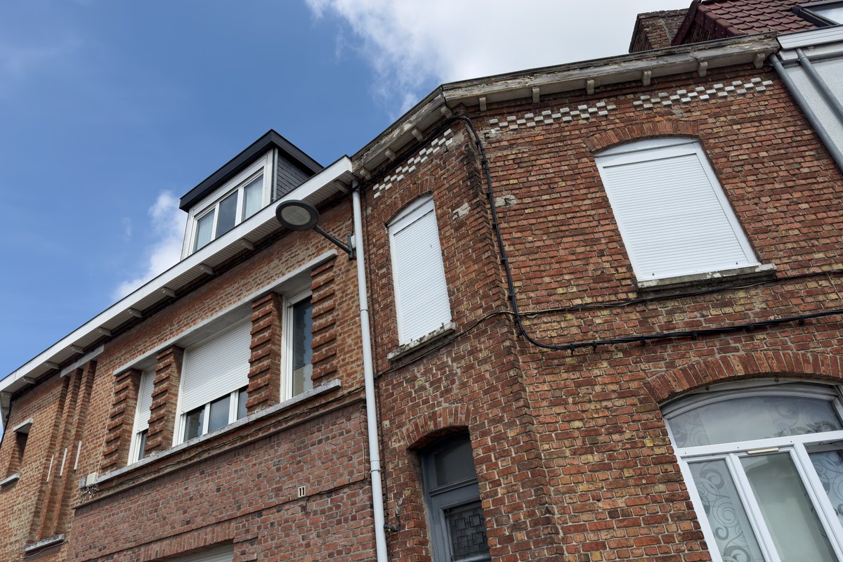 Completed brick facade restoration on a Baltimore City rowhouse